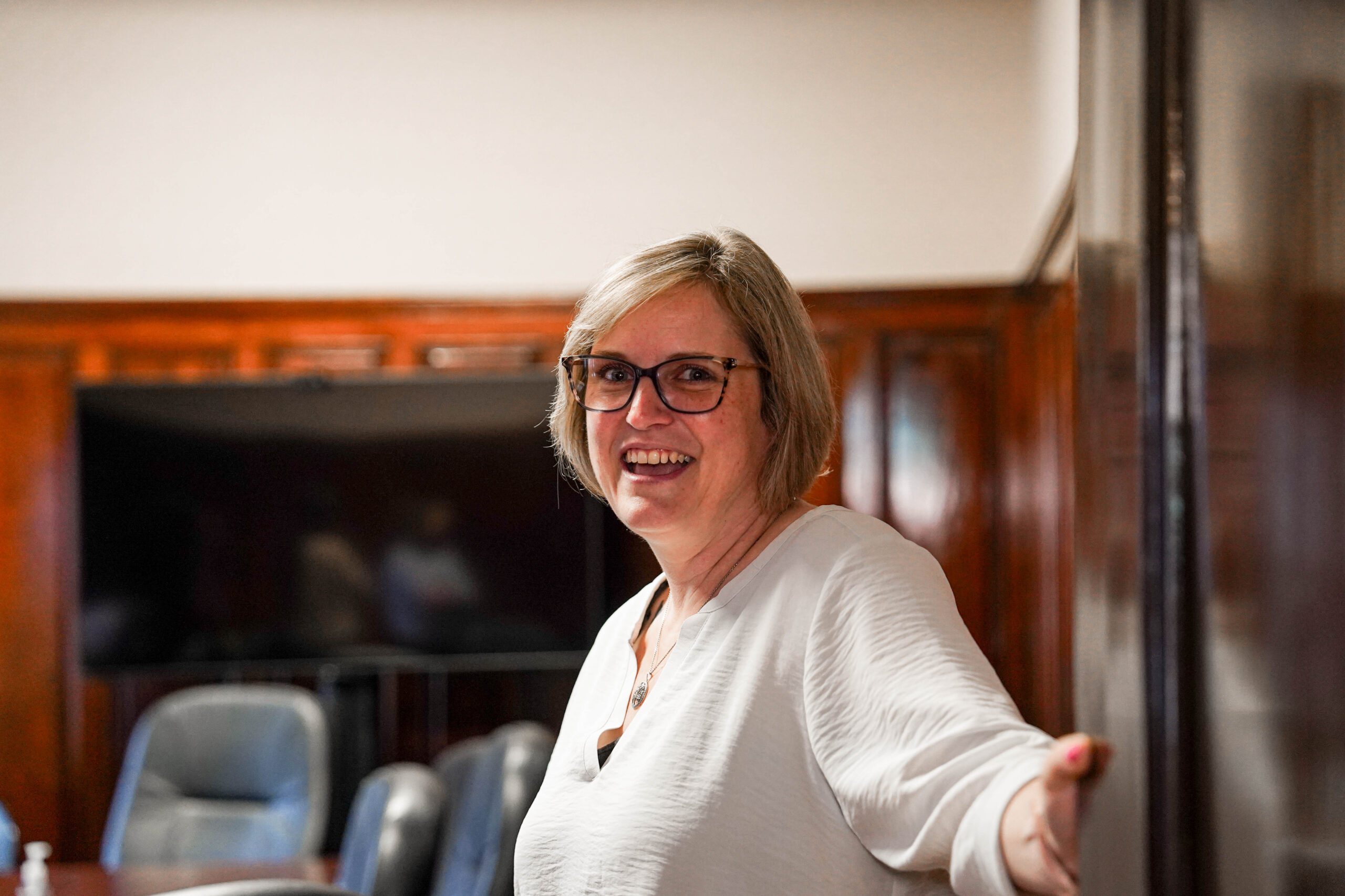 Shannon Galarneau opening a door, representing careers at Vera House